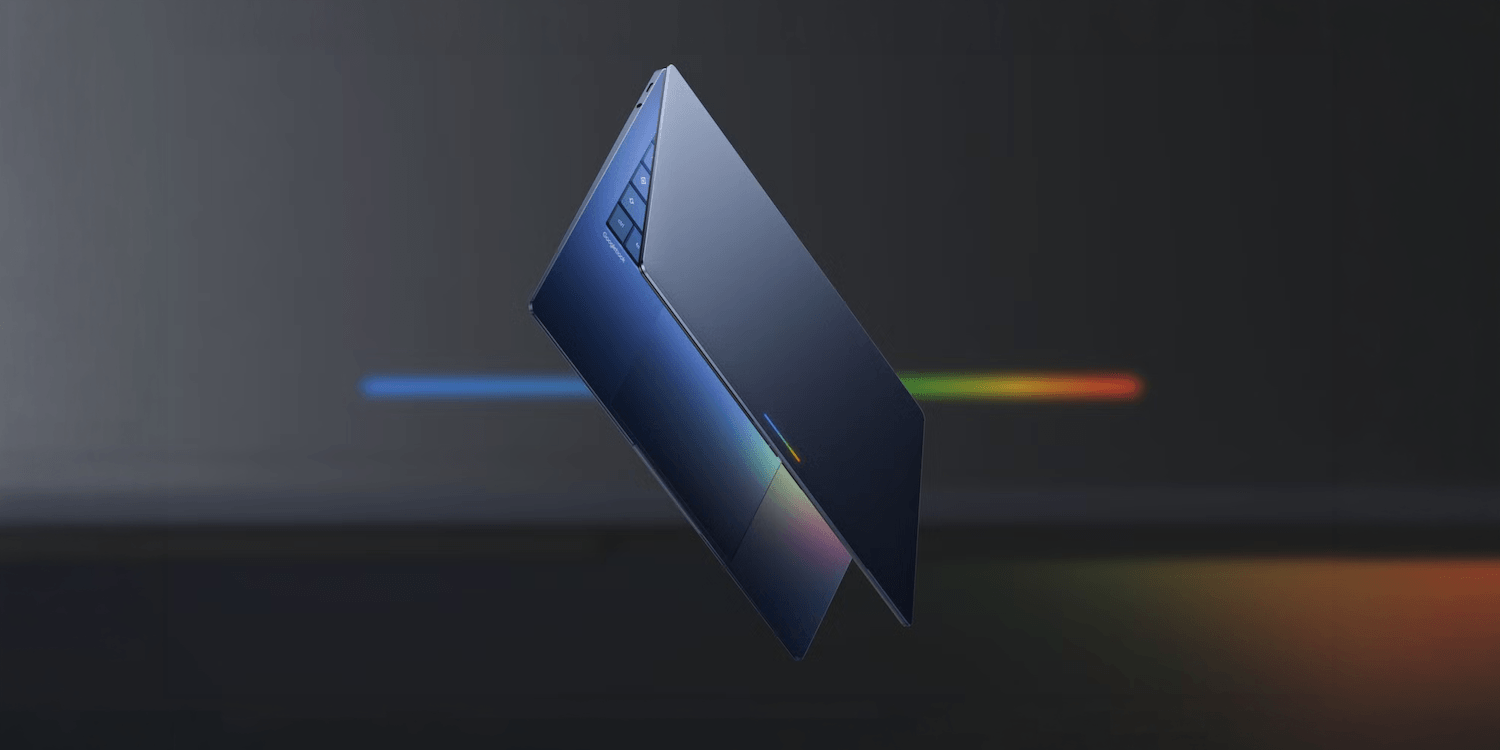 A sleek, blue laptop is shown floating against a dark background with colorful lines.
