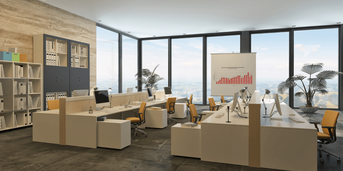 Modern open-plan office with multiple desks, computers, orange chairs, large floor-to-ceiling windows, indoor plants, and a presentation board displaying a bar chart.