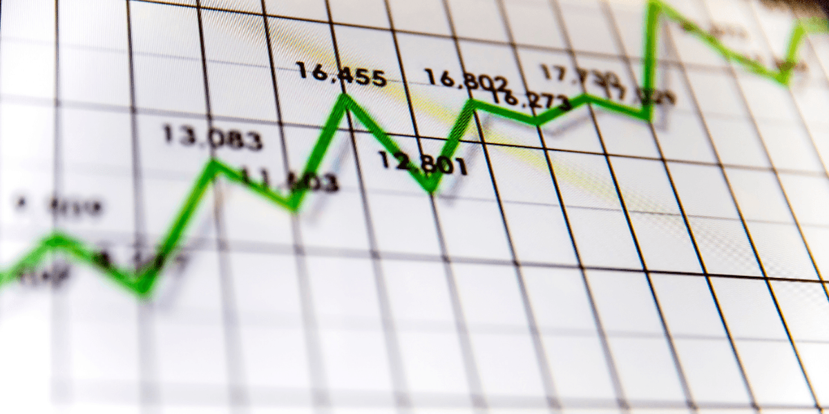 Green upward-trending line graph showing corporate earnings and financial market performance.