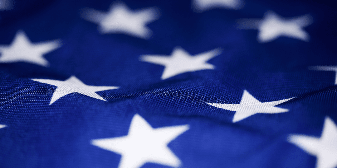 Close-up of a blue fabric with white stars, resembling a flag pattern
