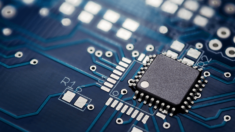 Close-up of a semiconductor chip mounted on a printed circuit board.