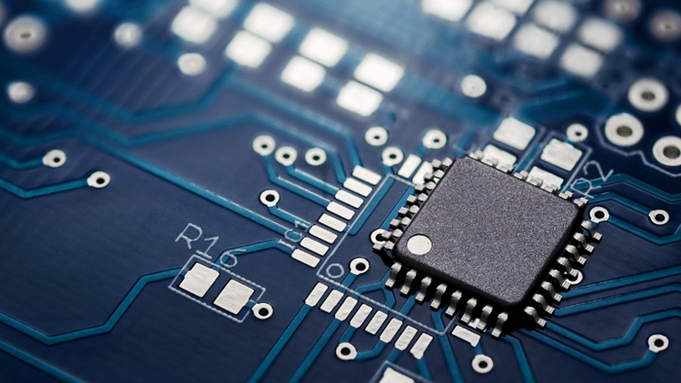 Close-up of a semiconductor chip mounted on a printed circuit board.