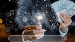Businessperson holding a light bulb and cash with digital finance and technology icons overlay.