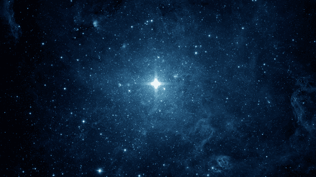 Vast blue starfield with bright stars and nebulae scattered throughout the cosmos