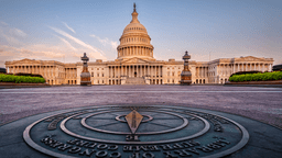 The U.S. Capitol building at sunrise, featuring a prominent compass rose in the foreground