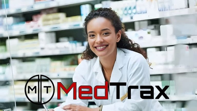 Smiling pharmacist in a white coat at a pharmacy counter with shelves of medications, MedTrax logo overlayed."