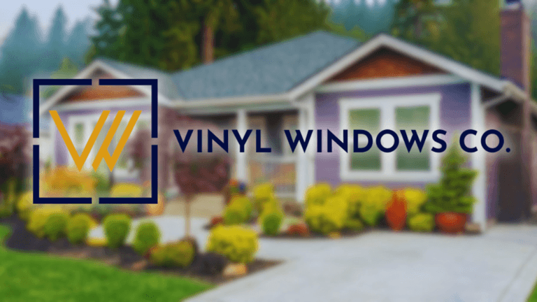 Image of house with Vinyl Windows Co logo: A modern home featuring vibrant landscaping with Vinyl Windows Co logo in foreground.