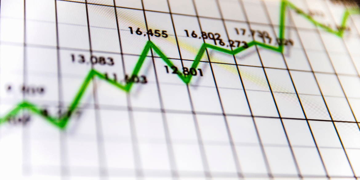 Green upward-trending line graph showing corporate earnings and financial market performance.